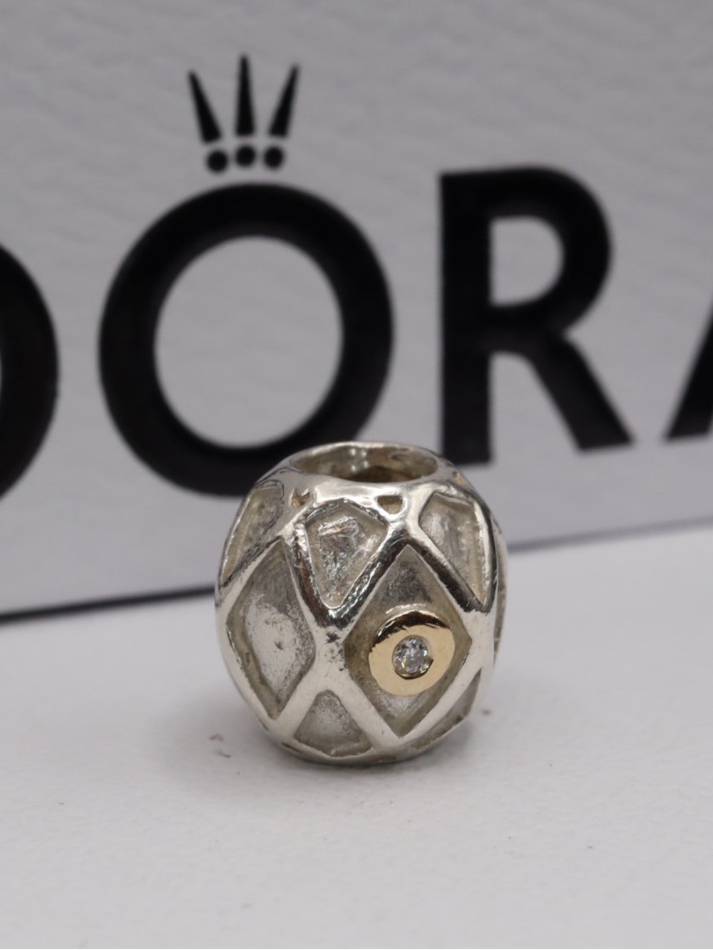 Pandora Harlequin Web charm with 14kt gold and diamonds
